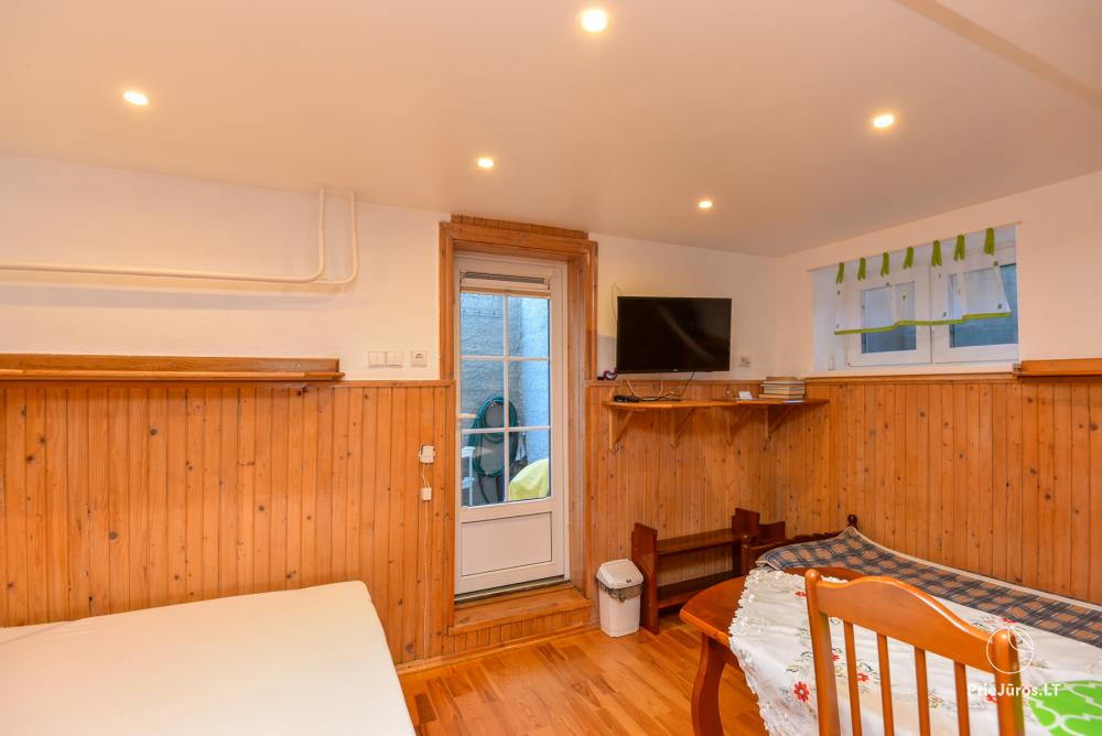 Rental of private rooms with amenities in the cottage JOANA in Nida