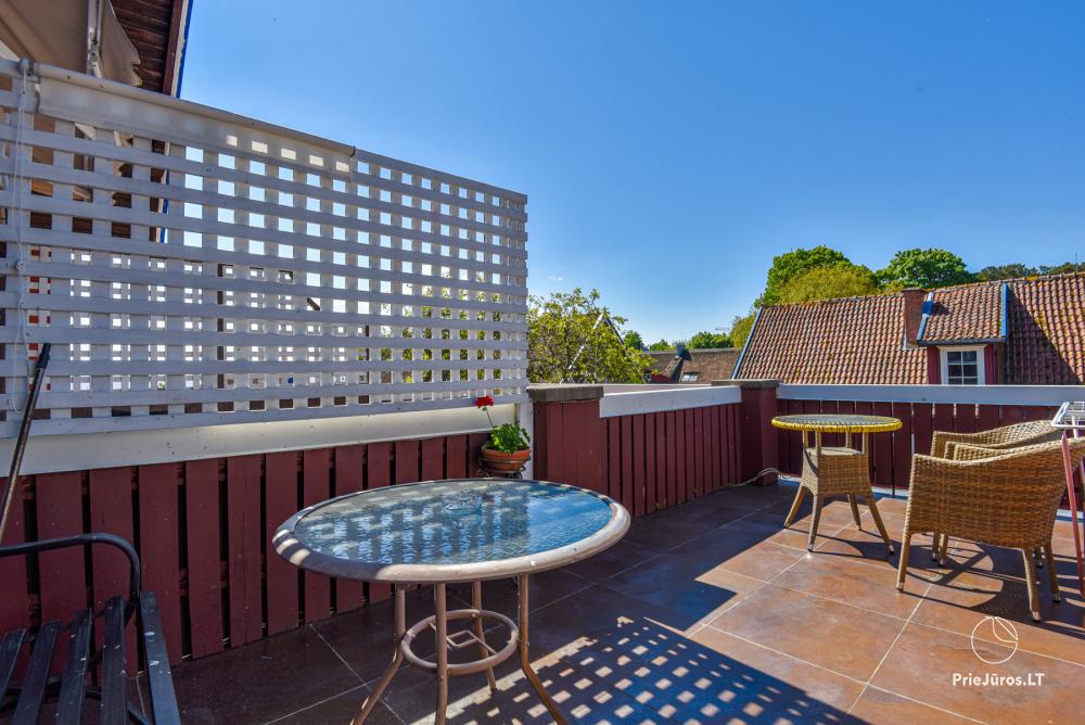 Rental of private rooms with amenities in the cottage JOANA in Nida