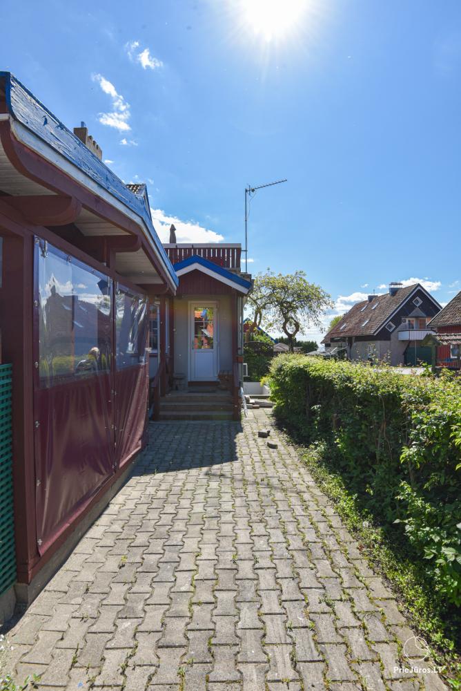 Rental of private rooms with amenities in the cottage JOANA in Nida