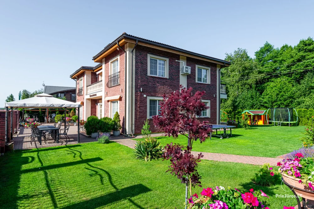 In Kunigiskiai, in Villa Optimistas apartments, rooms with kitchenettes, terraces or balconies. Two bedrooms holiday house with terrace. - 1