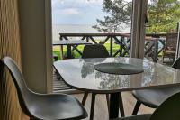 Cottage with a terrace in Nida and other apartments
