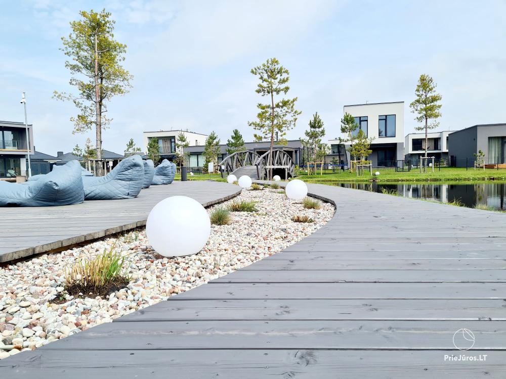 Auksinis Laikas Home - Mano jūra 1, Kunigiškiai apartments on the ground floor with a nice terrace, pool, hot tub, sauna in the complex
