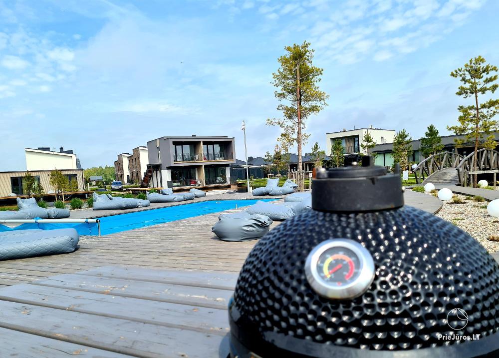 Auksinis Laikas Home - Mano jūra 1, Kunigiškiai apartments on the ground floor with a nice terrace, pool, hot tub, sauna in the complex