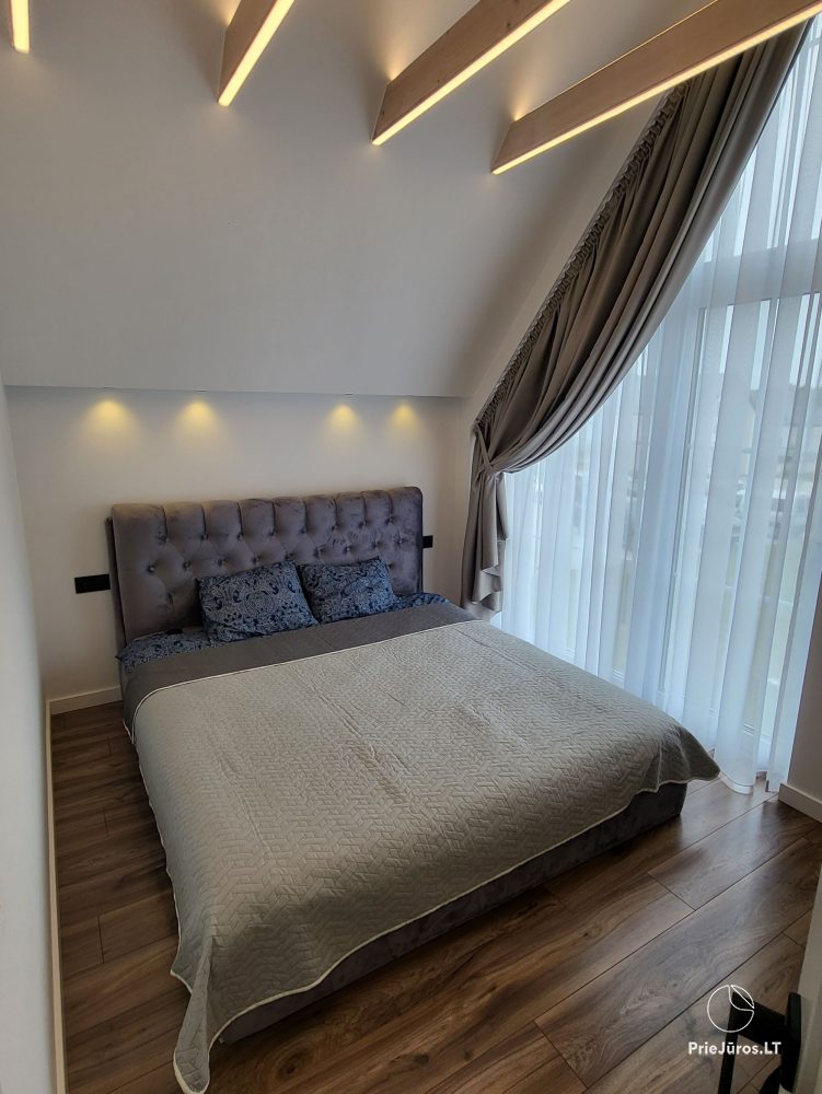 New cottage with spacious terrace up to 6 persons in Kunigiskiai