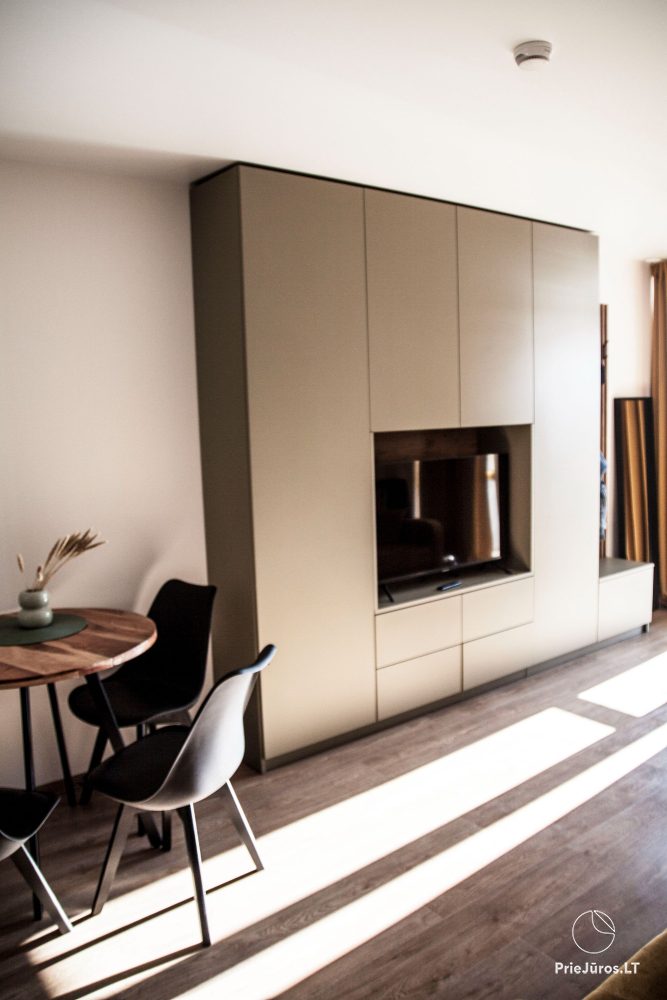 Cozy apartment with heated outdoor pool, gym and children's playroom near the sea!