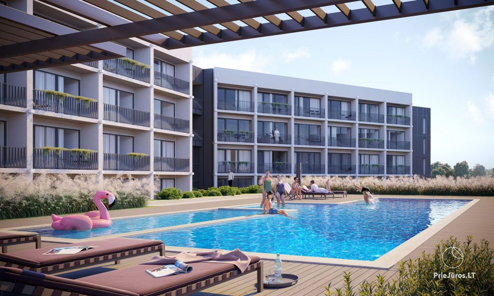Cozy apartment with heated outdoor pool, gym and children's playroom near the sea!