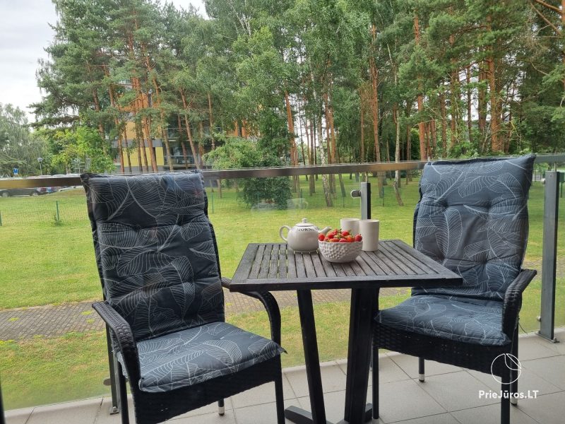 Sunny holiday flat-studio with terrace in calm place near the sea