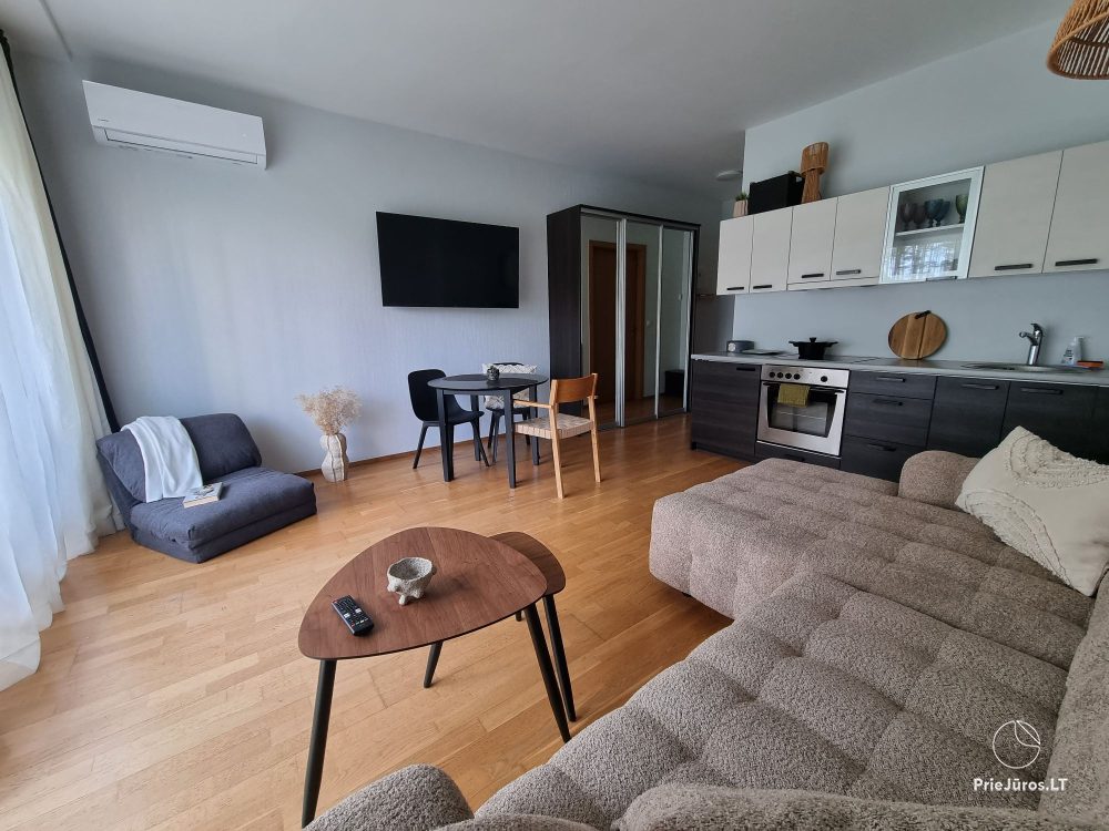 Sunny holiday flat-studio with terrace in calm place near the sea