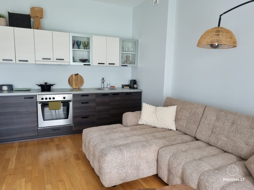 Sunny holiday flat-studio with terrace in calm place near the sea