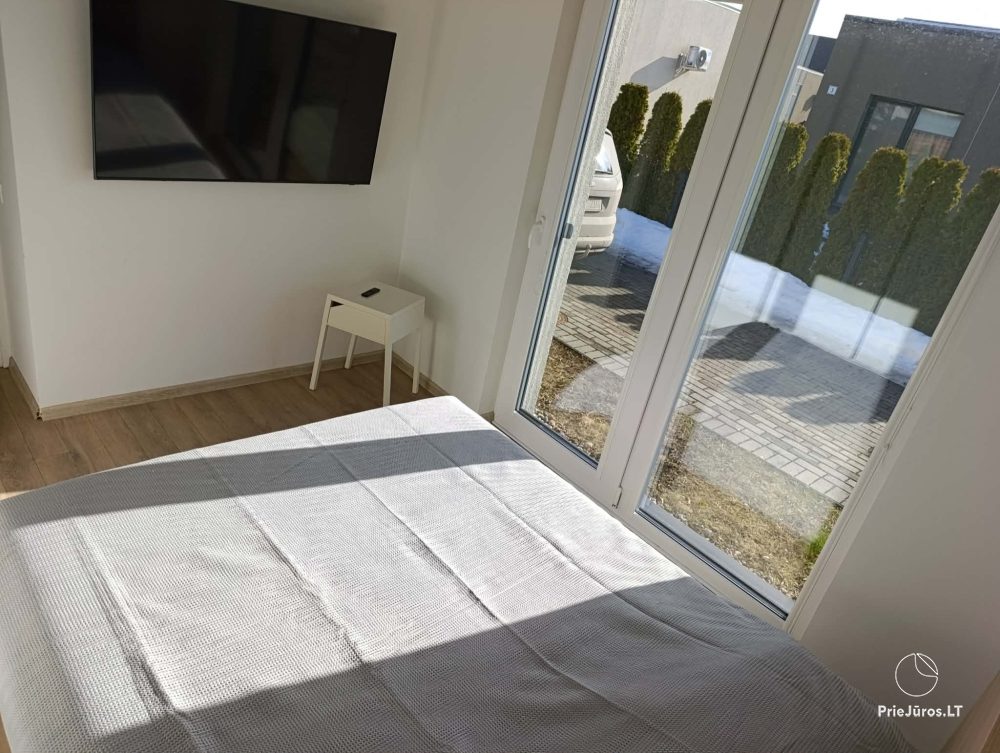 House rental in Kunigiškės with terrace and hot tub.