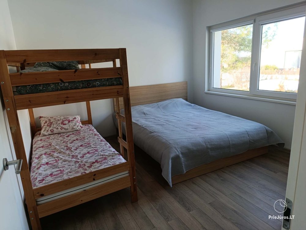 House rental in Kunigiškės with terrace and hot tub.