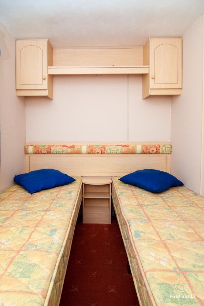 Little holiday houses with conveniences for rent in Sventoji