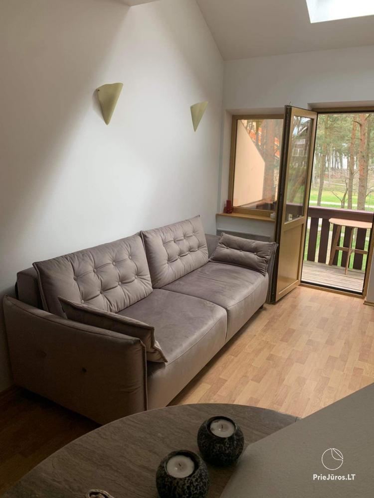 Cottage for rent in Nida with balcony, fireplace, Wi-Fi, free parking