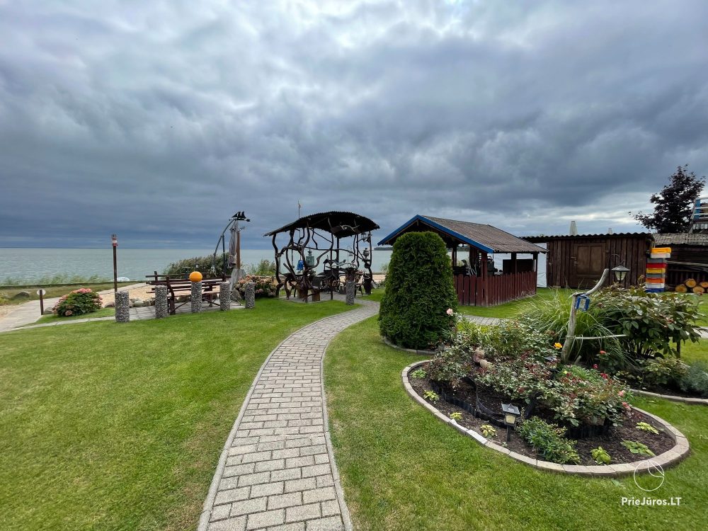 Preila 91 - Rooms for rent in Preila. An arbor in the yeard with the view to the lagoon!