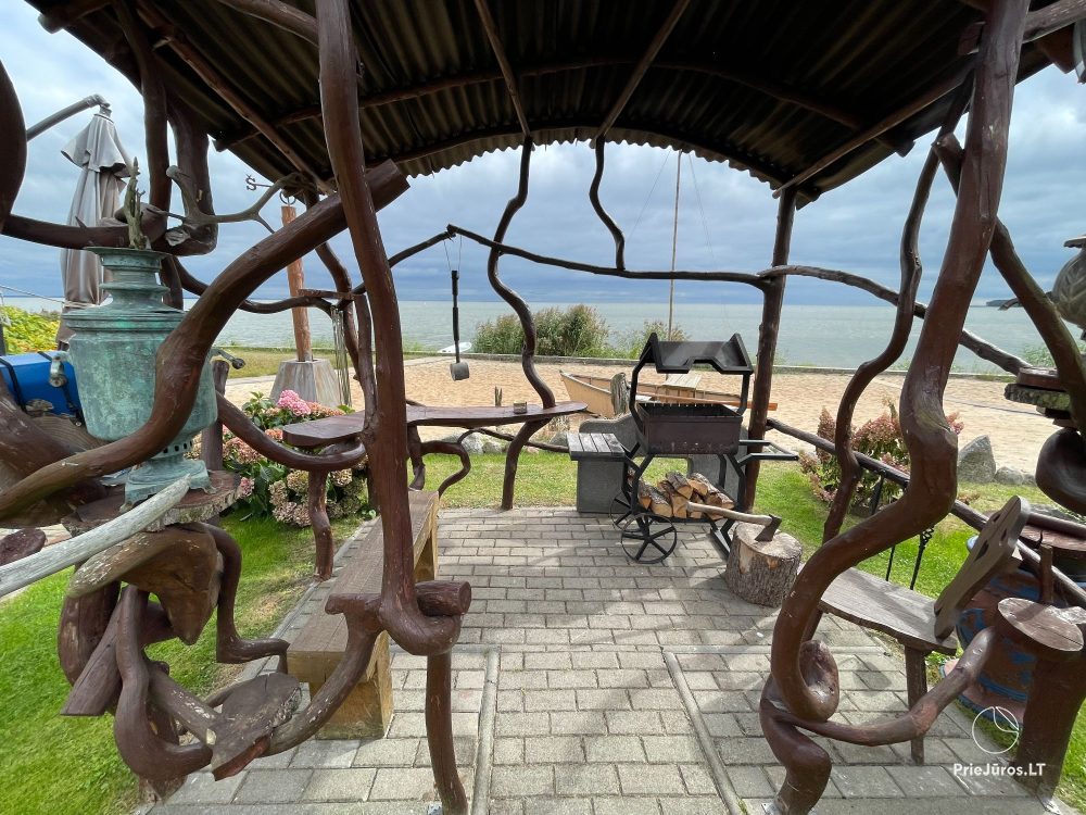 Preila 91 - Rooms for rent in Preila. An arbor in the yeard with the view to the lagoon!