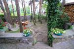 Accommodation in Palanga villa VAKARE. In the yard: summerhouses with outdoor furniture, playground for kids - 5