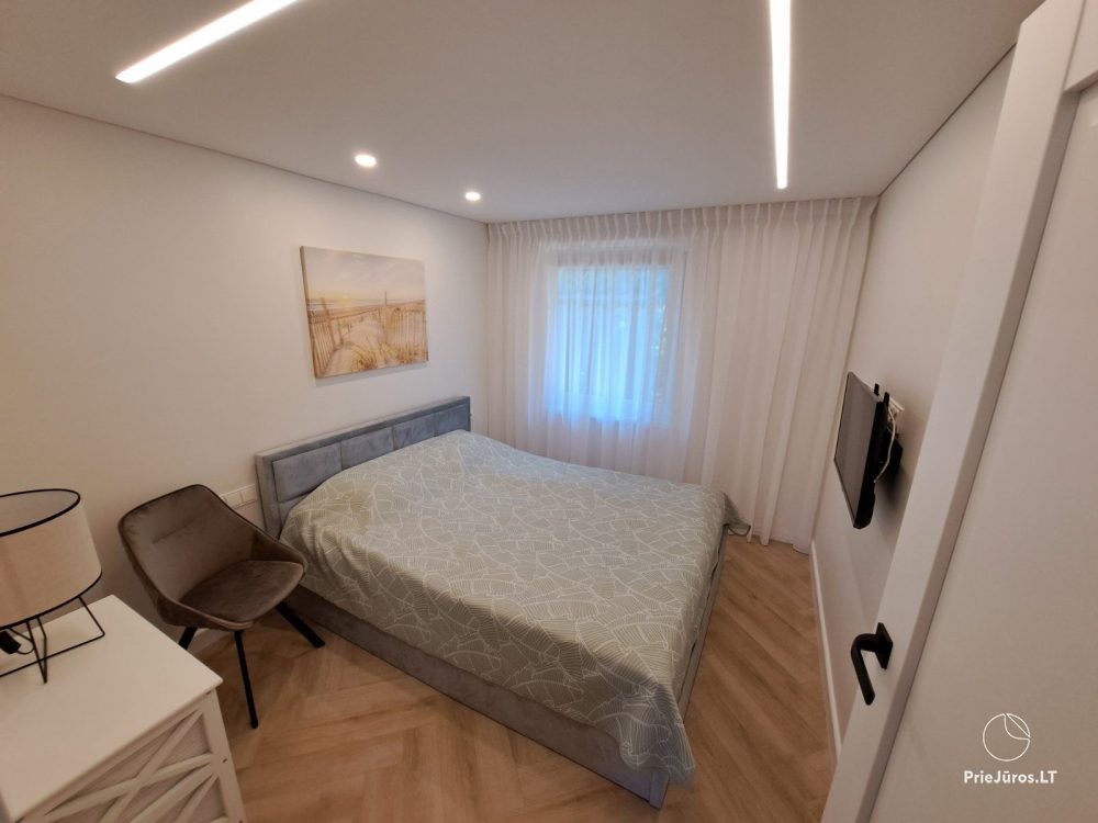 Stylish apartment with a private yard and a cozy house overlooking the lagoon for rent in Preila