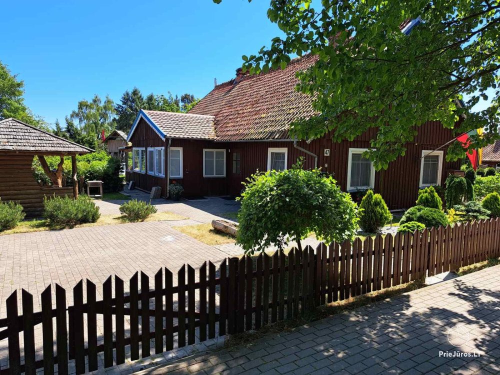 Stylish apartment with a private yard and a cozy house overlooking the lagoon for rent in Preila