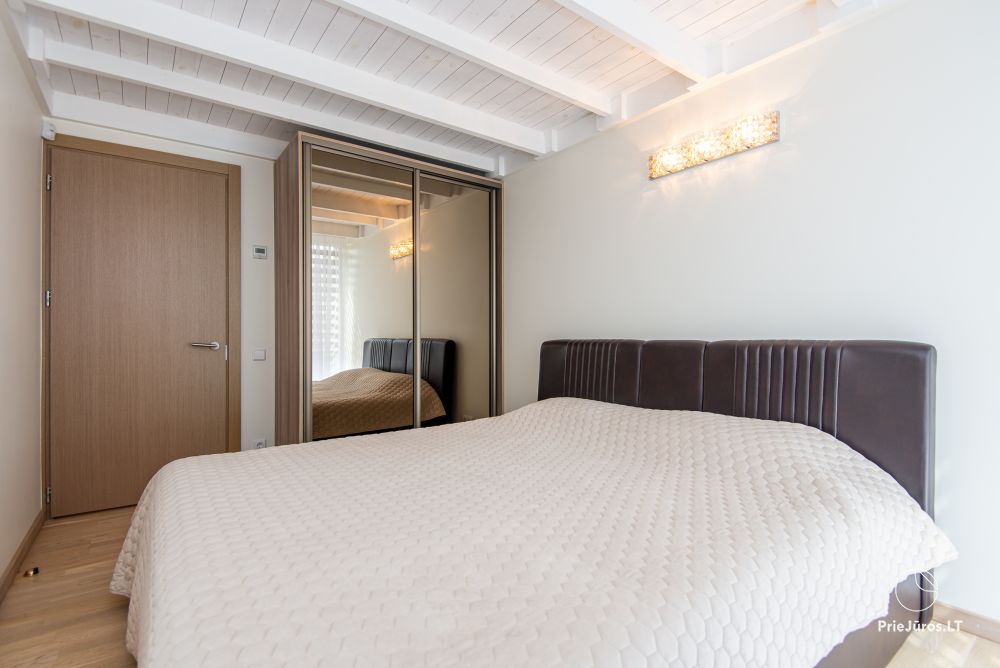 Apartments in Kunigiškiai. Terrace with a view of a pine forest, 200 m from the sea