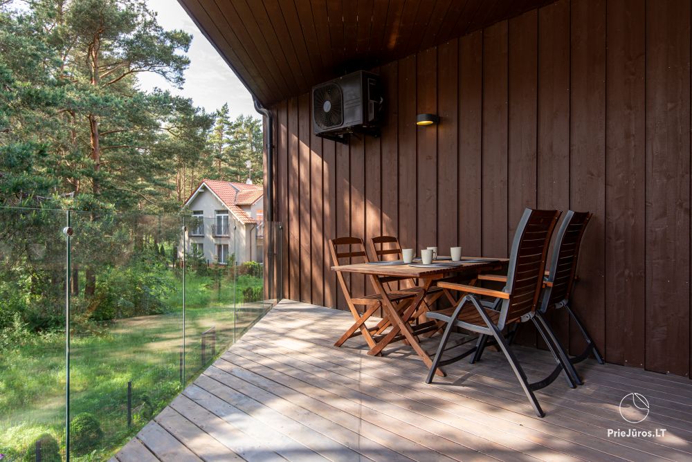 Apartments in Kunigiškiai. Terrace with a view of a pine forest, 200 m from the sea