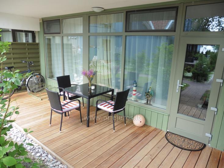  Cozy two-room apartment of 35 m² with a terrace on the ground floor. View on Curonian Lagoon