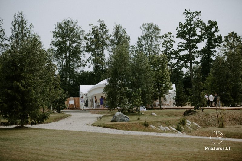 Pavilion for celebrations on the shore of the lake