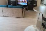 Modern apartment in the center of Palanga: private lawn with terrace and outdoor furniture