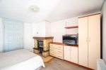 Room with a fireplace and a separate entrance from the yard - 2