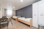 No. 3 Room with three single beds and a separate bathroom on the ground floor. - 1