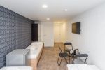 No. 3 Room with three single beds and a separate bathroom on the ground floor. - 4